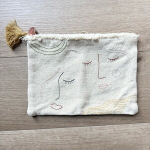 NWOT Fringe Studio Embroidered Face Design Pouch with Tassel Canvas Embroidered
